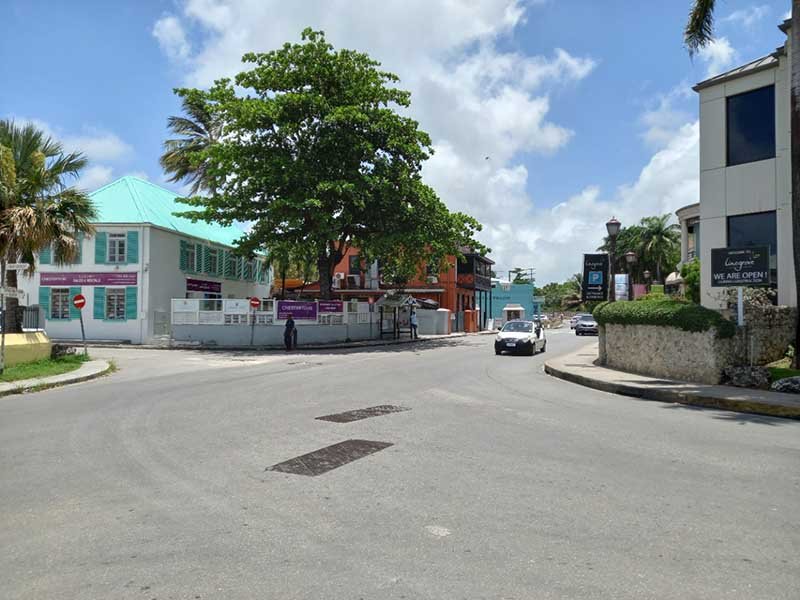 Sunny street view with cars in Holetown, Saint James, Barbados