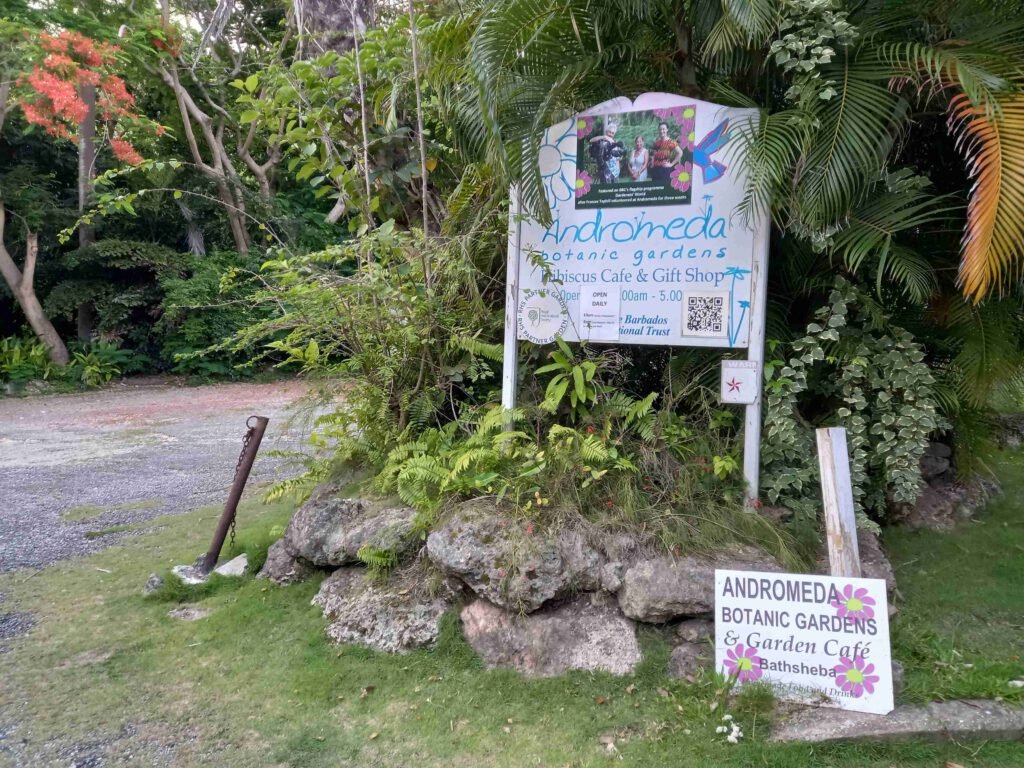 Entrance sign of Andromeda Botanic Gardens with lush greenery in Bathsheba, St. Joseph, Barbados