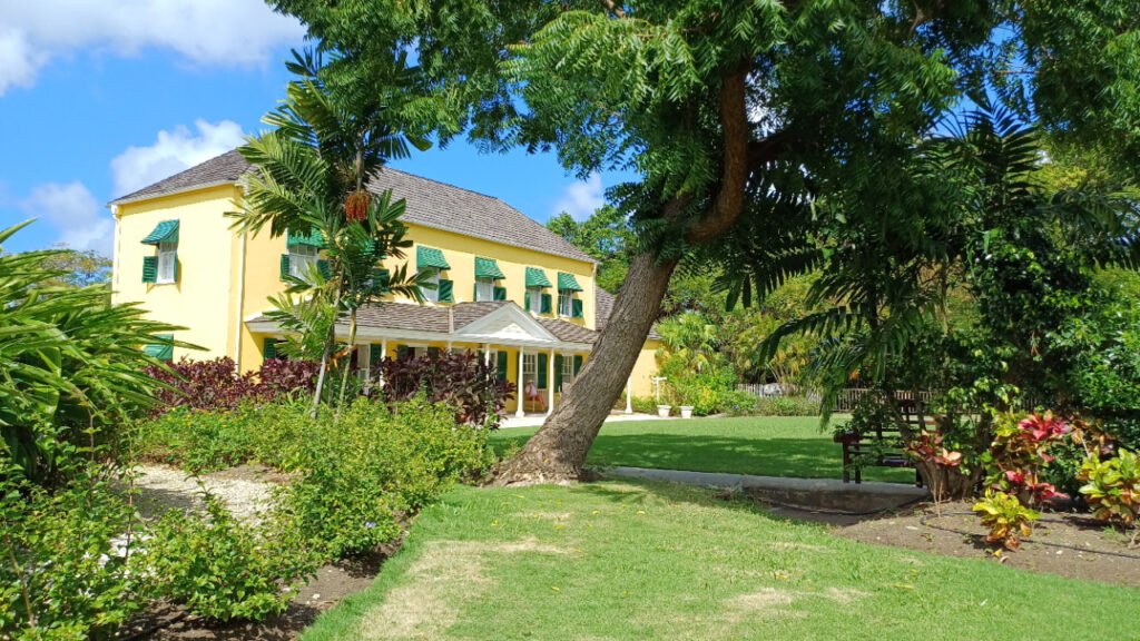 George Washington House surrounded by lush gardens under the bright Barbadian sun, The Garrison, Bridgetown, Barbados