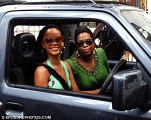 Rihanna and Oprah inside a car smiling