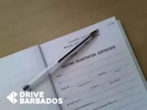 Blank visitor's registration certificate with a pen on top