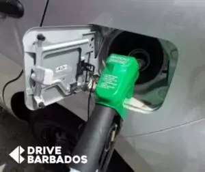 Rental Car refueling at a gas station with a green nozzle