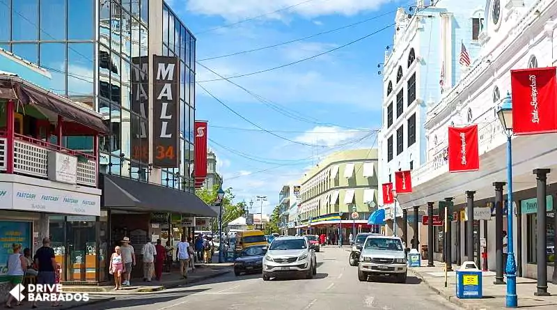 Busy broad street in bridgetown, barbados, with pedestrians and cars captured by drive barbados