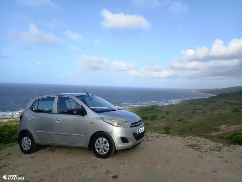 Economy car on Barbados coastline for a budget-friendly drive