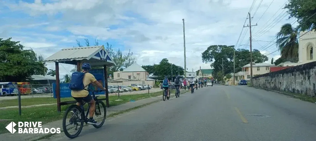 Tourists cycling through Barbados streets—exploring the island with local bicycle rental services.
